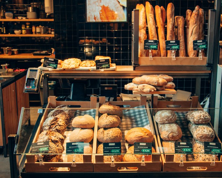 Bread and pastries on the counter of a small bakery